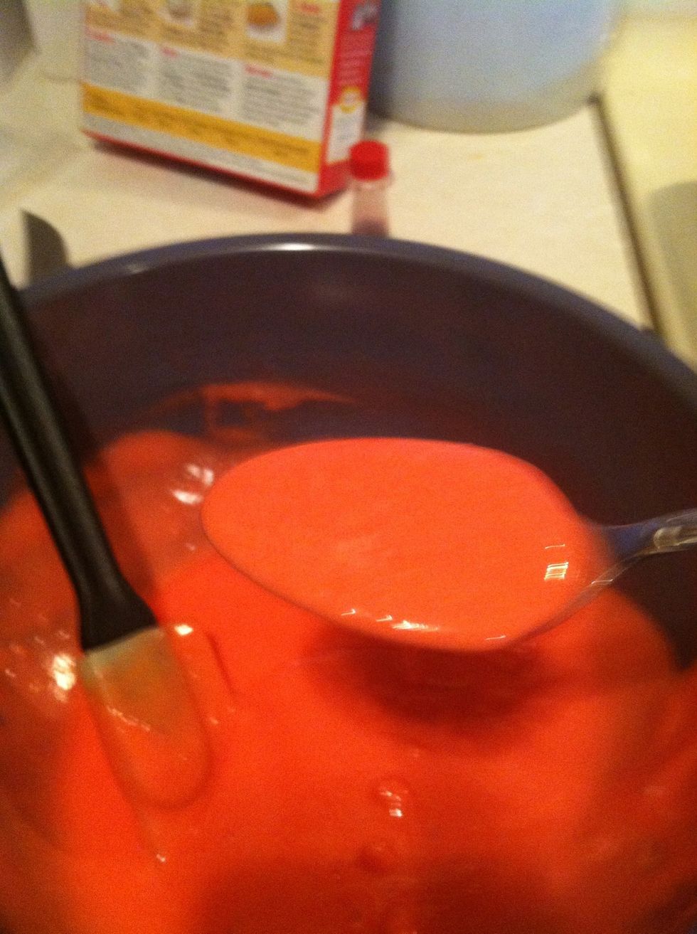 Using a different spoon, fill the cups up to 1/2 full with the red batter.