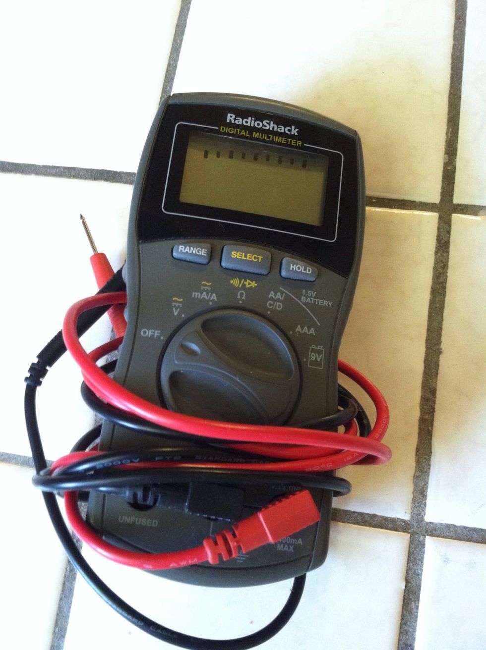 Using a digital multimeter we tested each battery once it was full. I used this $20.00 Radio Shack cat. no. 22-813.