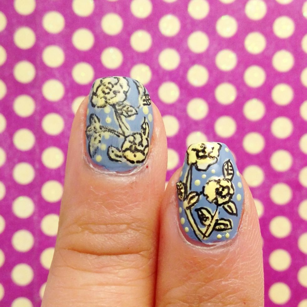 Using a dotter, add in dots in the negative space of the design.