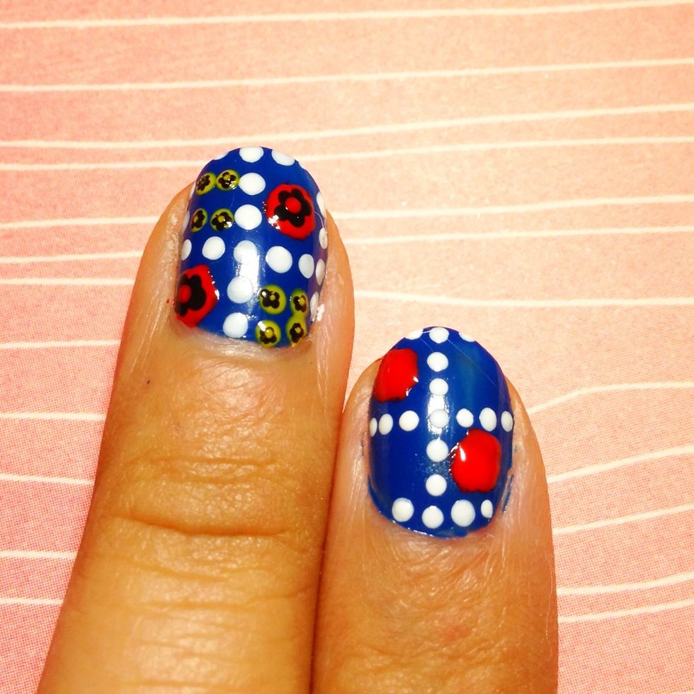 Using a dotter or nail art brush create two big circle in opposite corners.