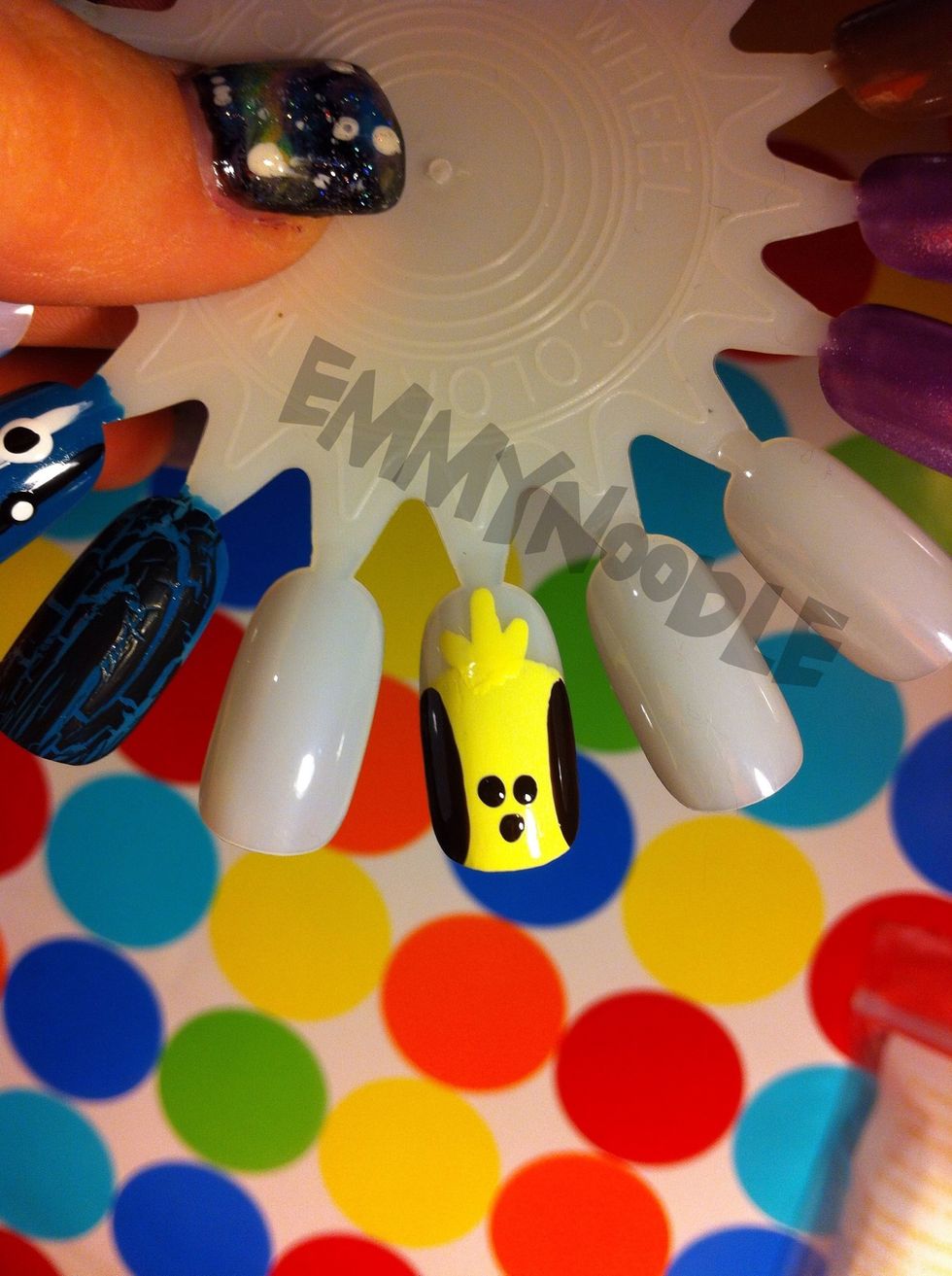 Using a dotting tool, make three brown dots on his belly.