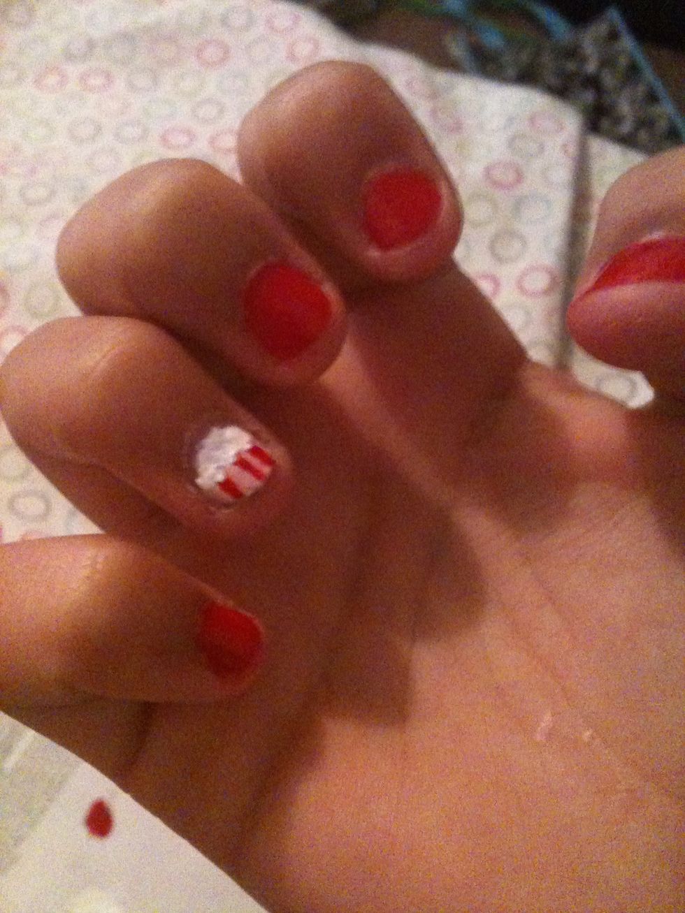 Using a dotting tool make white icing