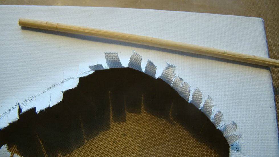 Using a dowel I curled the canvas for the eyelashes.