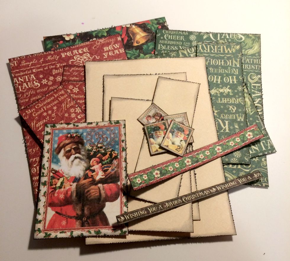 Using a edge distressor, distress the edges of the patterned paper and borders. Once the edges have been inked, use a blending tool and ink the edges of the papers using Black Soot Distress Ink.