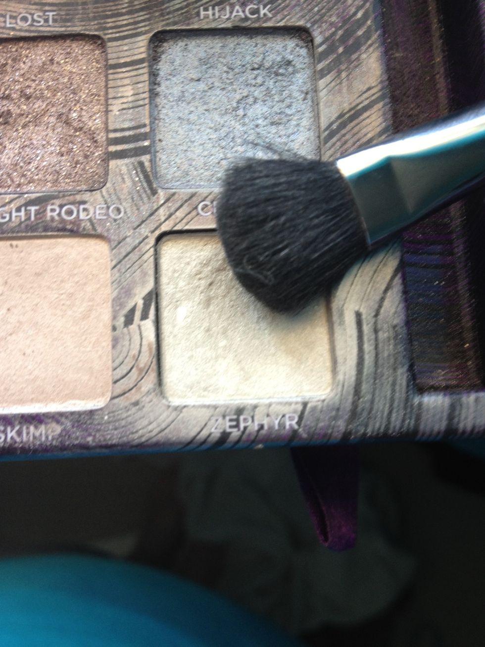 Using a fluffy brush, highlight your brow bone and the inside of your eye. Also use the bush to blend any hard edged shadows.