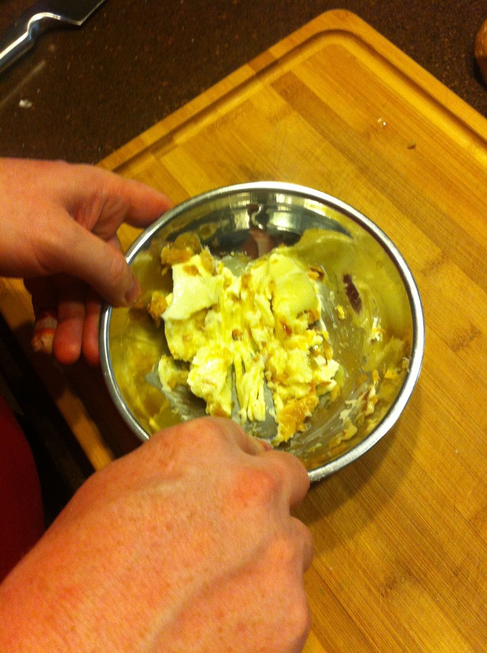 Using a fork, mix the garlic into the butter along with a pinch of salt (to taste)