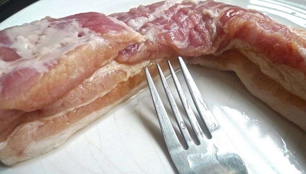 Using a fork, prick some holes on the pork. This helps the marinade to penetrate into the meat for more flavour.