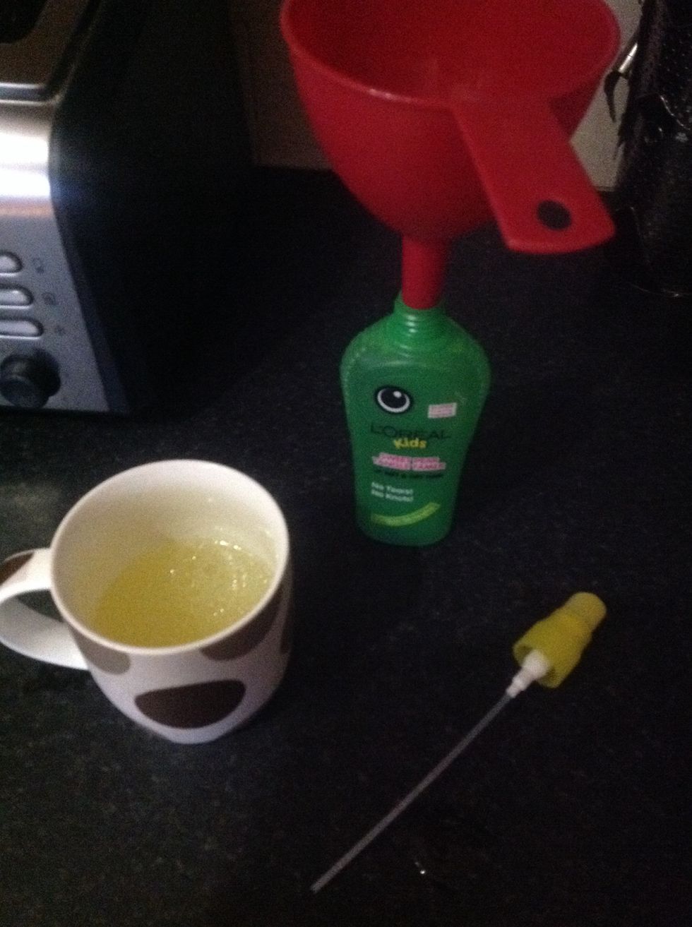 Using a funnel (optional) , put it into the spray bottle.