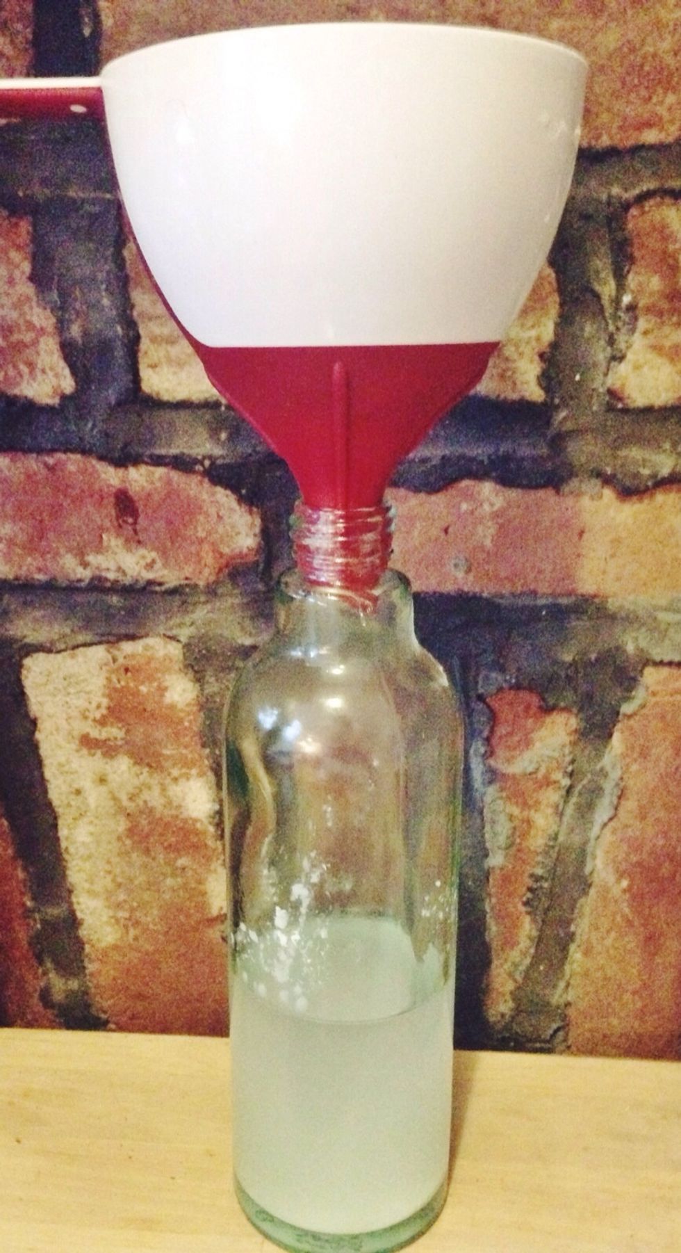 Using a funnel, pour all ingredients into a fine mist spray bottle.