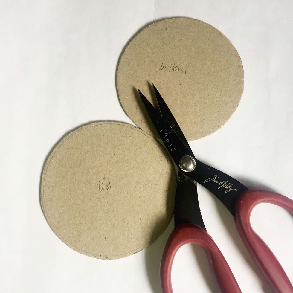 Using a heavy duty scissors, cut the bottom and lid.