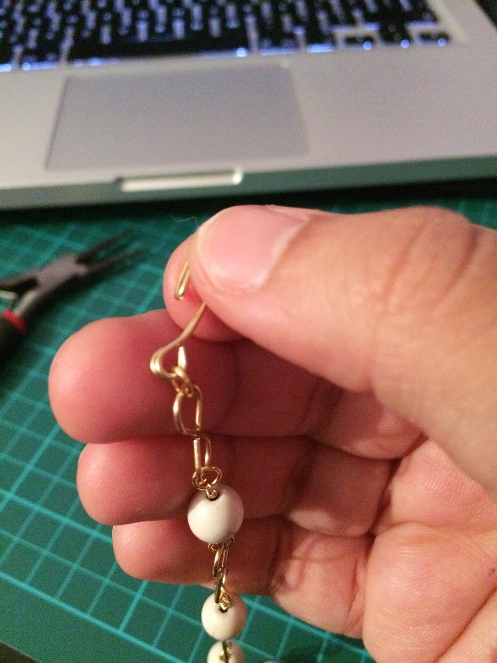 Using a jump ring, connect one of the links to the clasp.