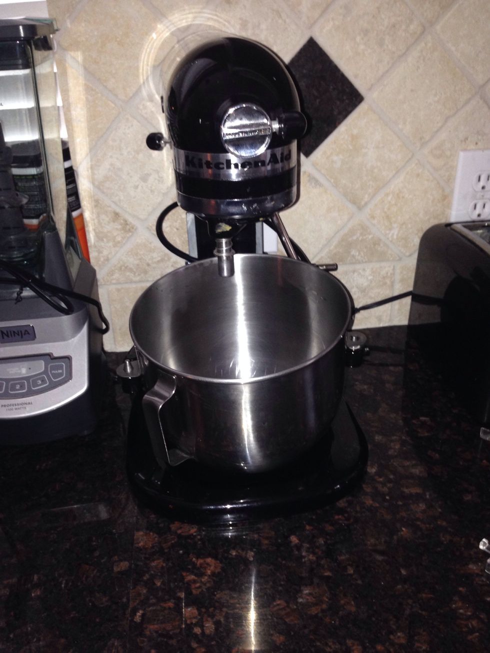 Using a Kitchen Aide or hand mixer with large mixing bowl, let's start preparing the cheese cake filling.