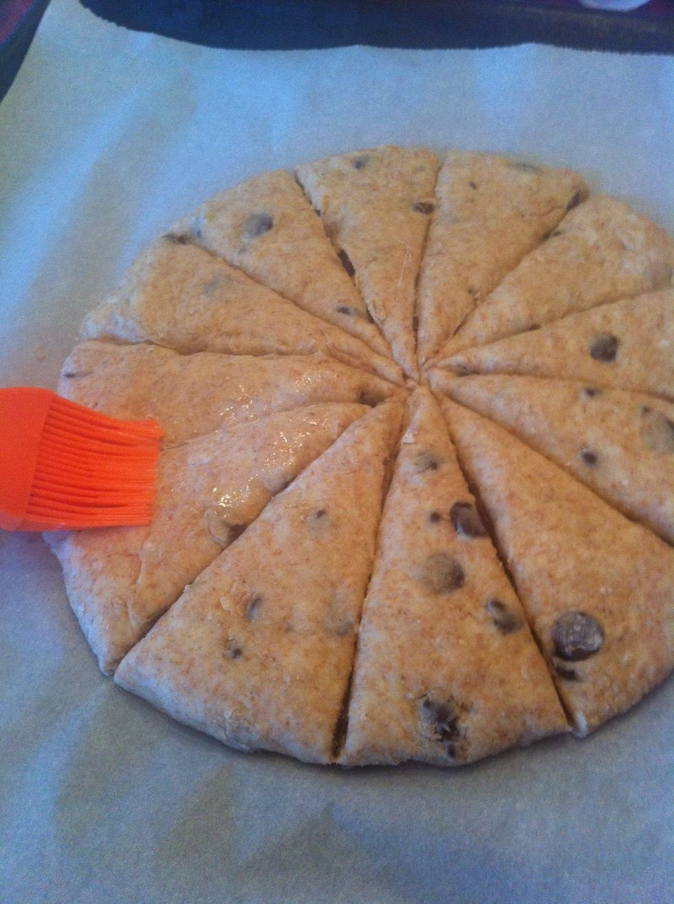 Using a knife and cut dough into 12 wegdes all the way through and brush with egg white or milk. Put in a preheated 375 degrees farenheit or 200 degrees celsius oven and bake for 18-20 min.