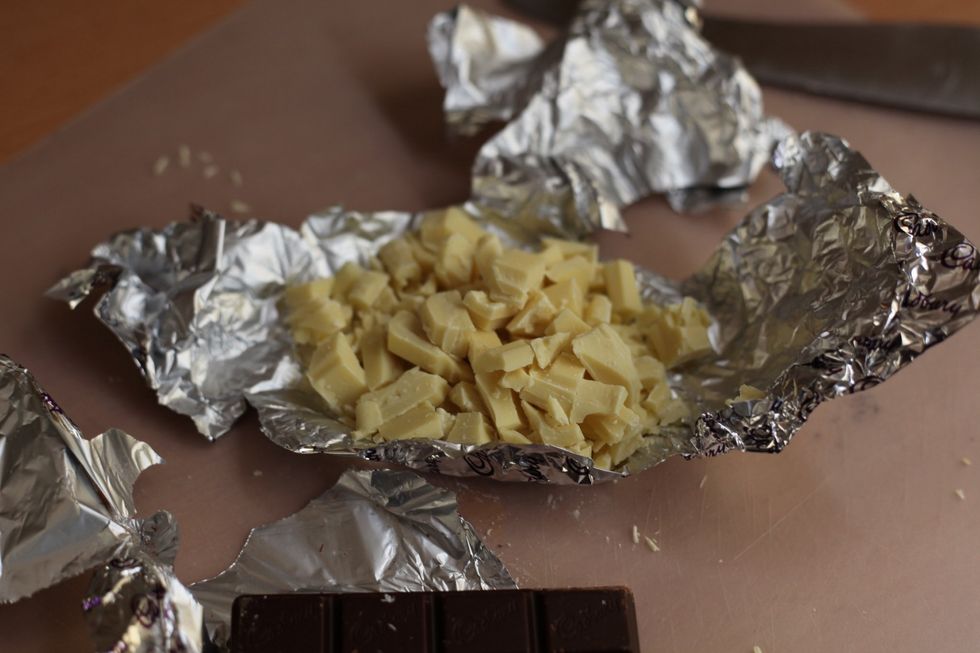 Using a knife chop some of your favourite white and dark chocolate.