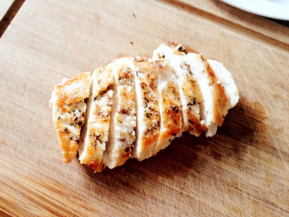 Using a knife, cut your chicken breast on a slight angle into even pieces.