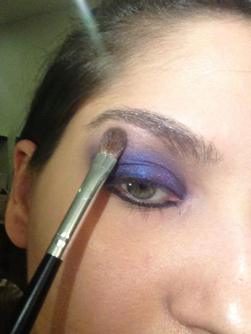 Using a lighter purple blend in the crease pushing upwards to your brow bone