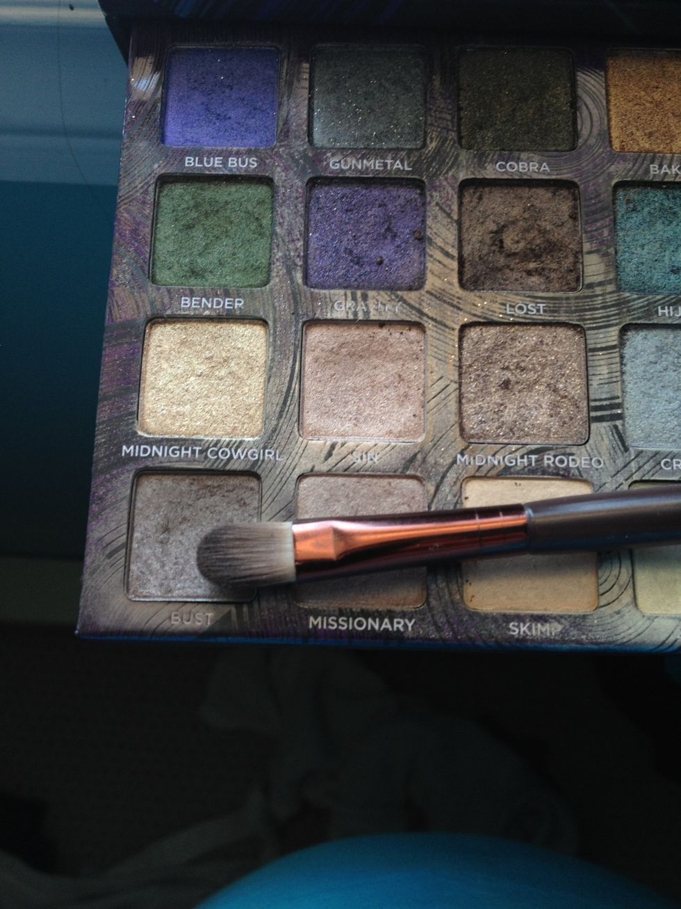 Using a makeup brush apply a mid-tone color ( your choice) along the crease