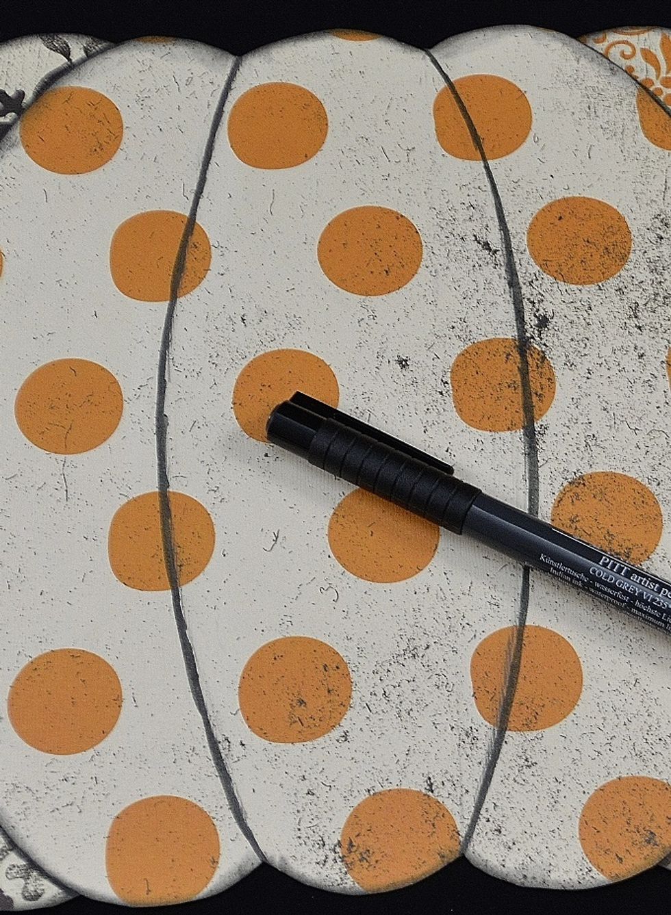 Using a marker draw lines to section your pumpkin.