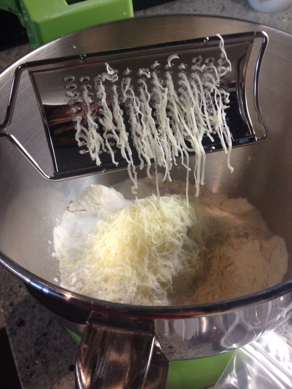 Using a micro-plane grater, grate the gruyere into the bowl and mix. (I didn't have gruyere this time, so I'm actually using old cheddar in the photo)