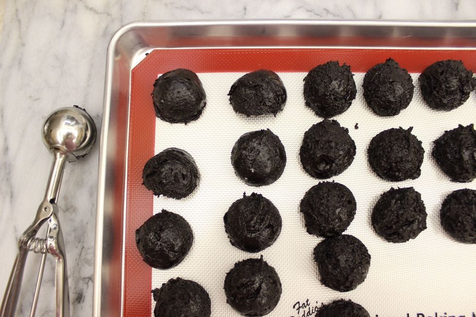Using a mini-ice cream/cookie scooper, scoop out even balls of Oreo dough. I made golf-ball sized balls using a 1 3/4 inch diameter scooper. If you don't have a scooper, you can use regular spoons.