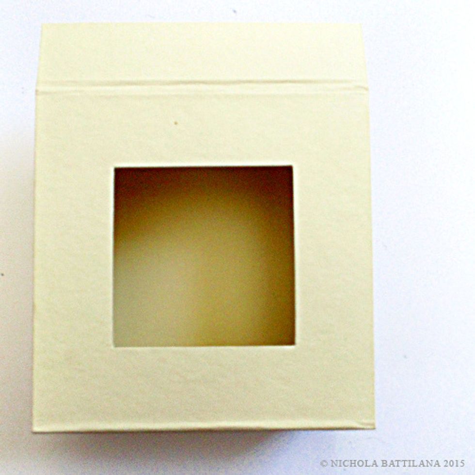 Using a Mixed Media 5x5 Box-Ivory straighten the closure flat as shown.