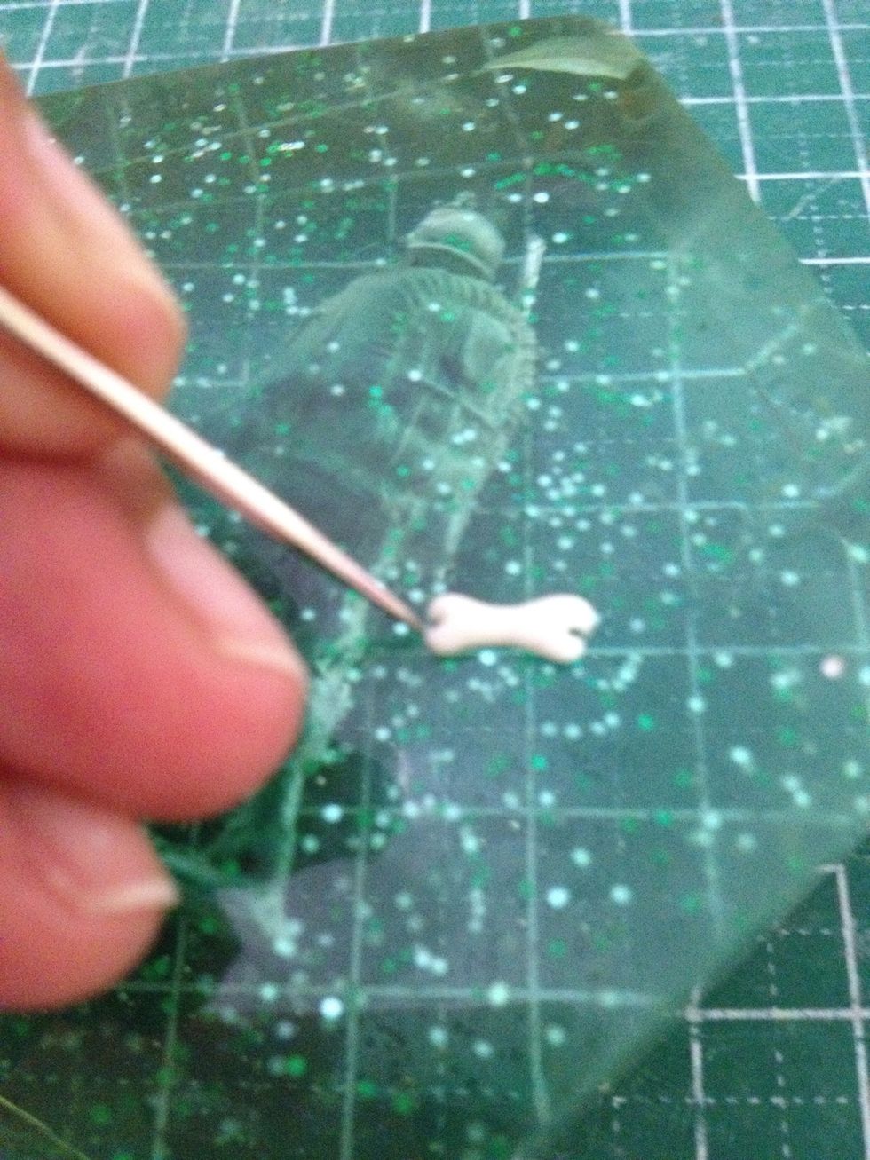Using a needle tool, shape out the bone.