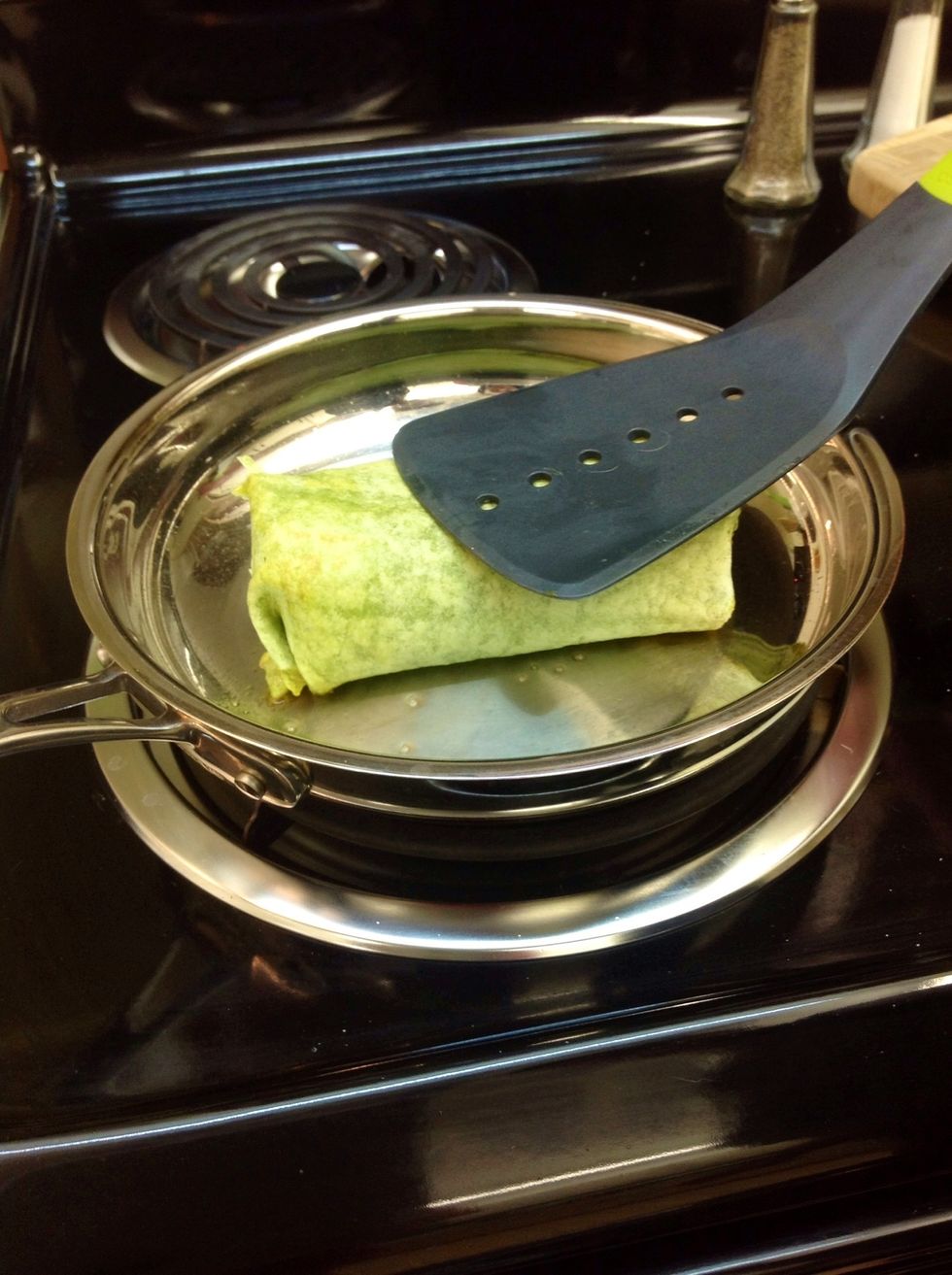Using a new smaller pan also on medium heat, press both sides of the wrap for approximately 30-60 seconds on each side( just enough to brown and make each side lightly crisp).