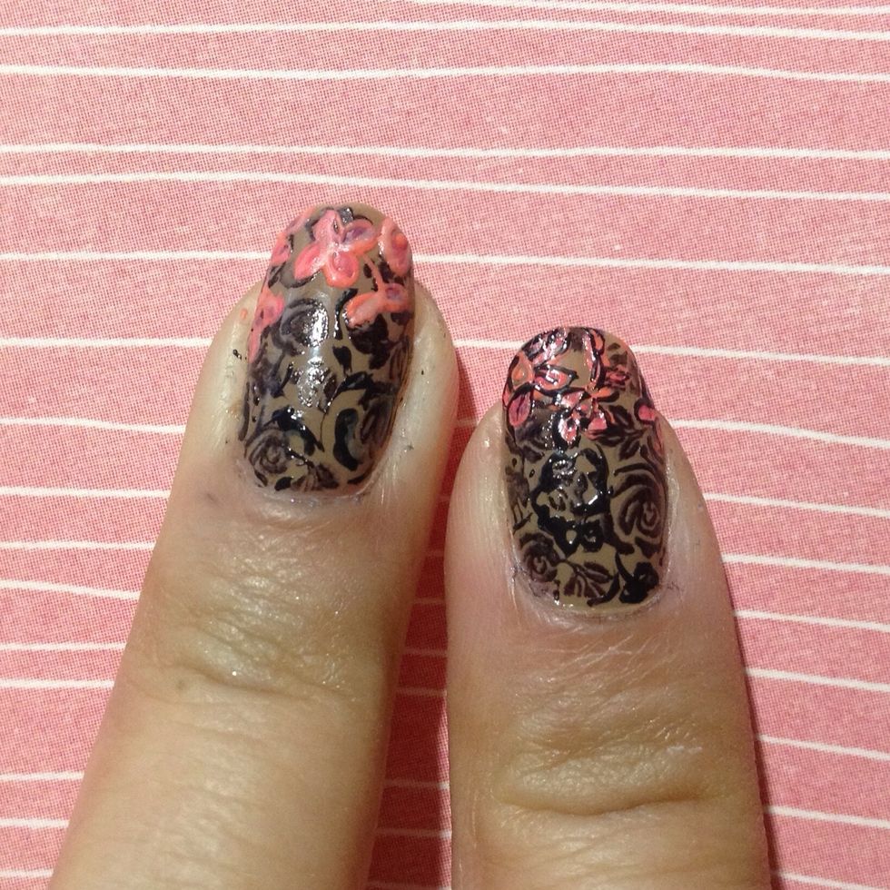 Using a pale pink polish, give your flower some highlight by creating a single line on each individual petal.