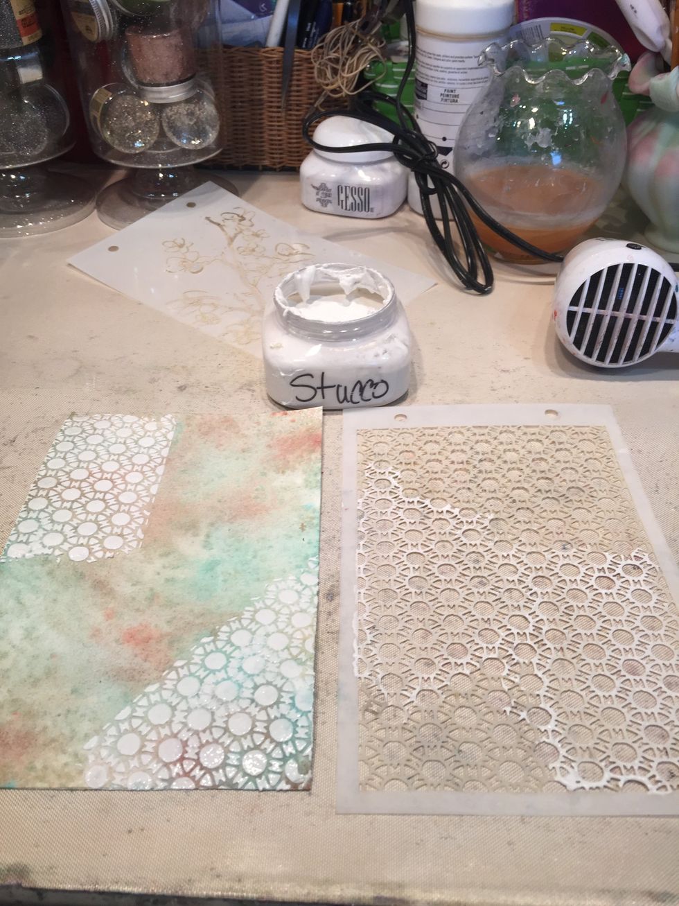 Using a palette knife, spread Stucco through the Retro Tile stencil.