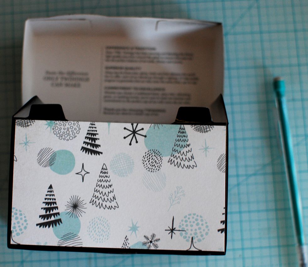 Using a paper cutter, cut each paper piece for each side, top and bottom.