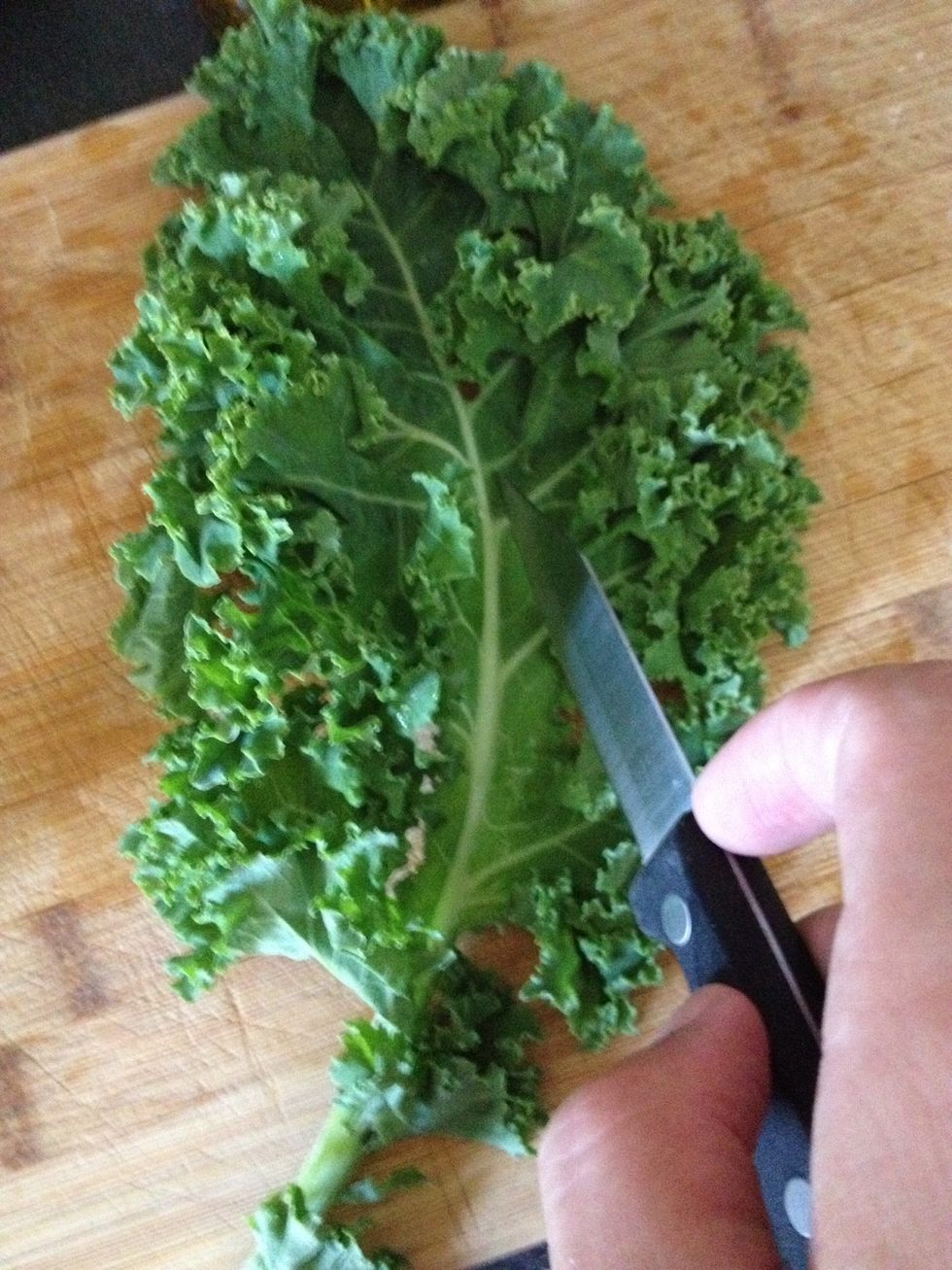 Using a paring knife, cut out center stalks.