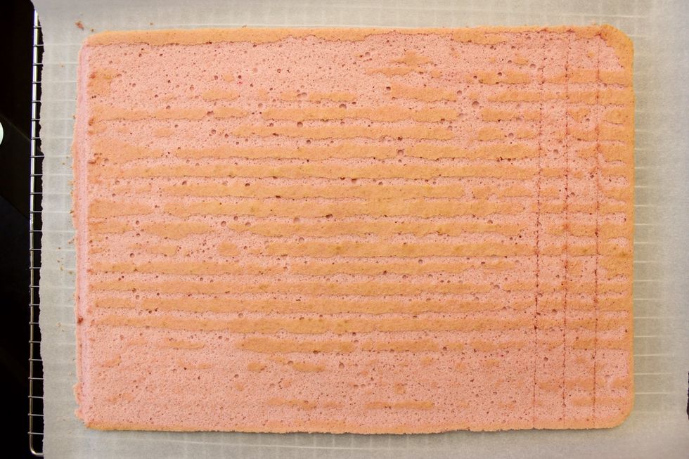 Using a paring knife, do a 45 degree cut off the left edge of the cake roll. Remove/eat the cut-off. This step is optional. I do it because it helps to taper the edge for rolling a more seamless cake.