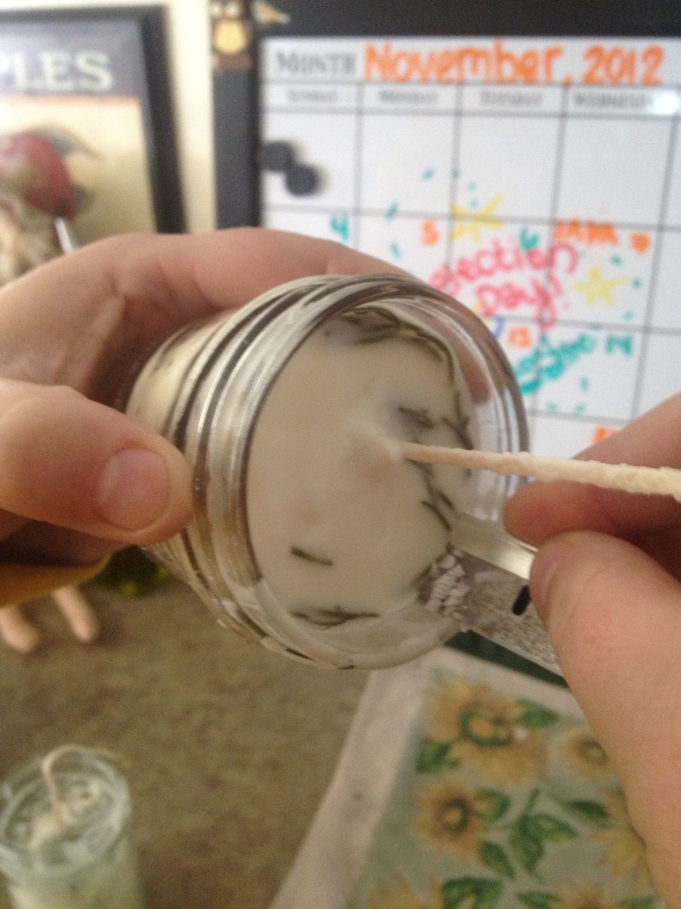 Using a razor blade, you can scrape around the rim of the inside and outside of the mason jar where the wax drips have hardened.