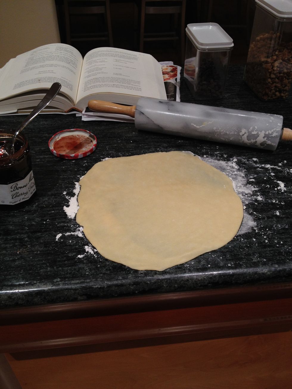 Using a rolling pin (tip: if you place your marble rolling pin in the fridge before using, your dough will not stick), roll into a 9 inch round.
