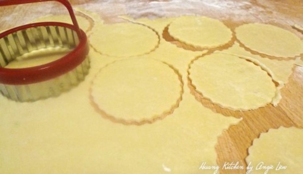 Using a round cookie cutter that\u2019s slightly bigger than the muffin cups, cut the pastry into 24 rounds.