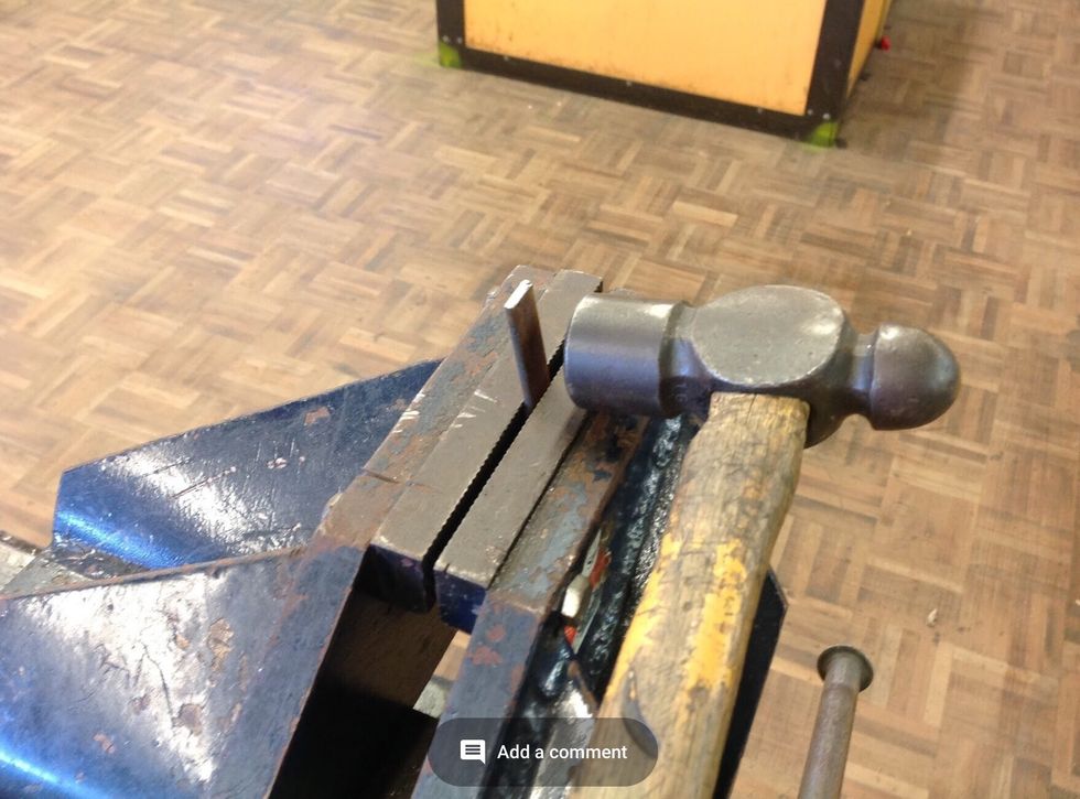 Using a ruler and scribe measure 1.5 cm in on the feet and 1cm from the hole on your scroll. Use a vice and ball pein hammer to hammer each side of the feet and the scroll to make it bend