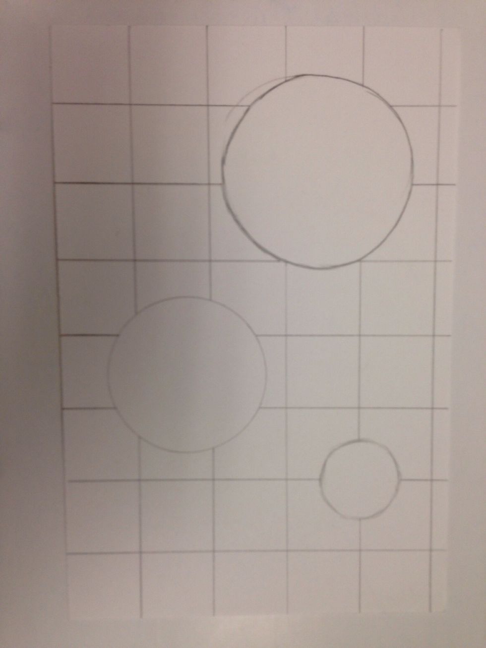 Using a ruler, draw horizontal stripes across the paper. Do not draw inside the circles.