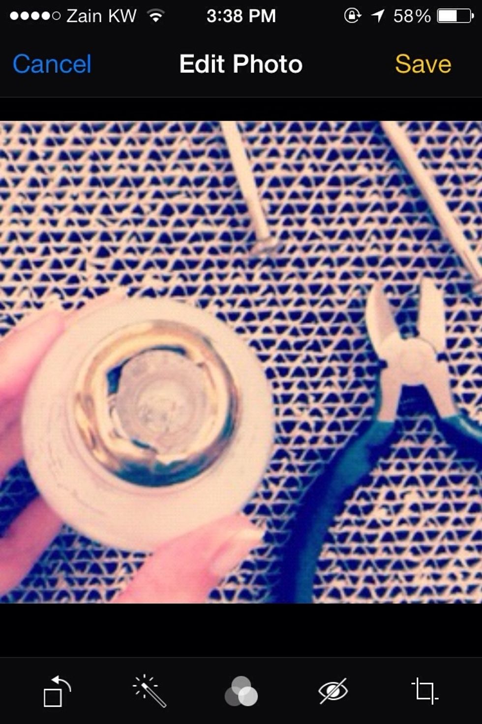 Using a screwdriver or scrapper remove the bottom metal part of the light bulb. It my look rigid but it will easily be removed.