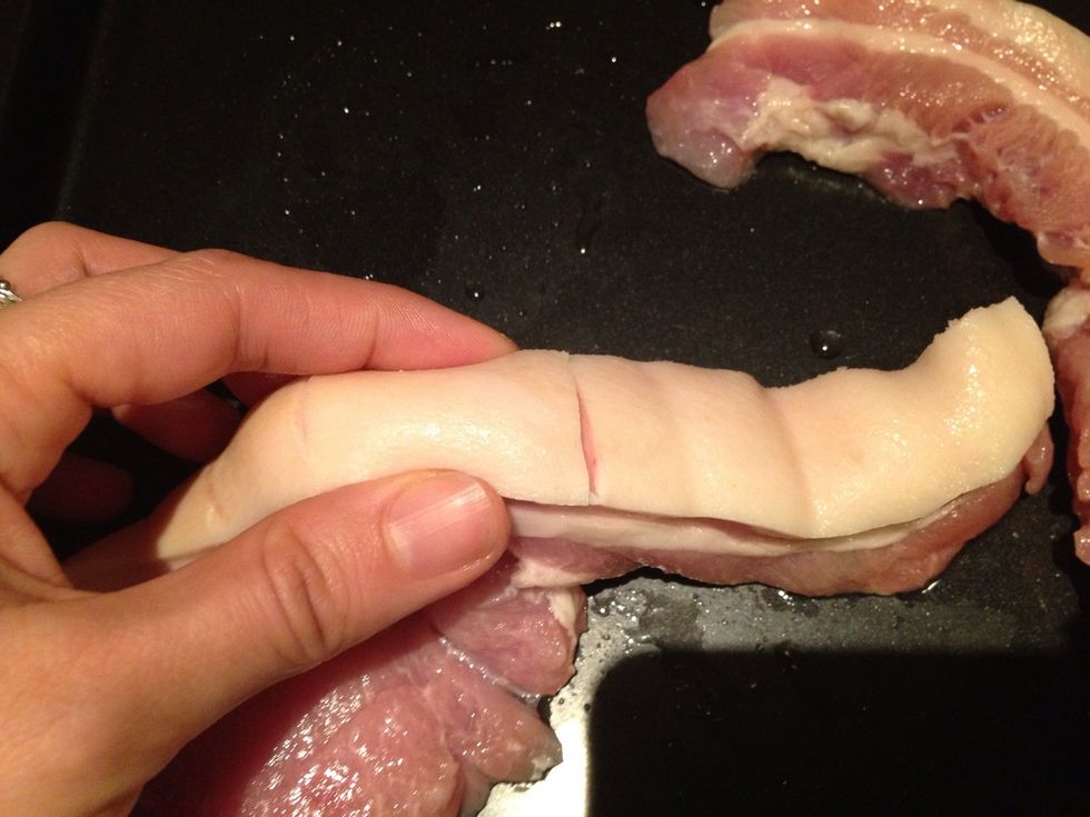 Using a sharp knife, carefully score the skin. Try to just make slits in the skin without cutting all the way through the fat. Leave a couple of centimetres (about an inch) between slits.