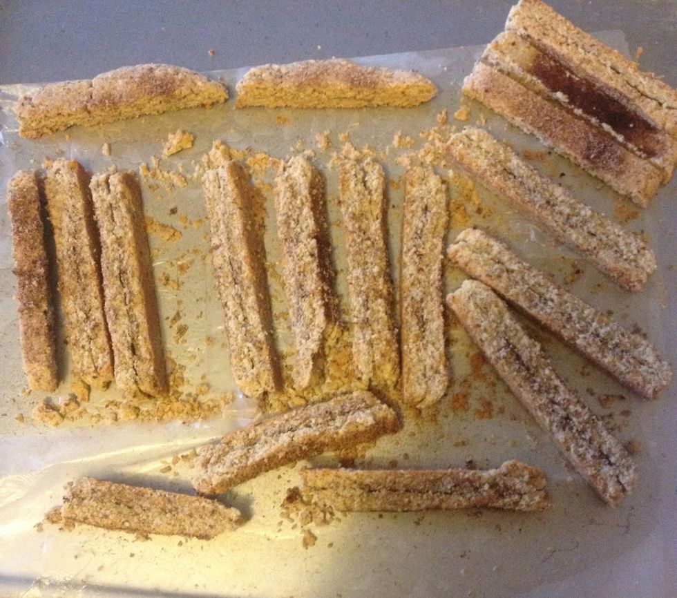 Using a sharp knife, cut into 15-17 pieces. Bake 15 min. Turn and bake an additional 15 min. Turn off oven and leave biscotti inside until completely cooled.