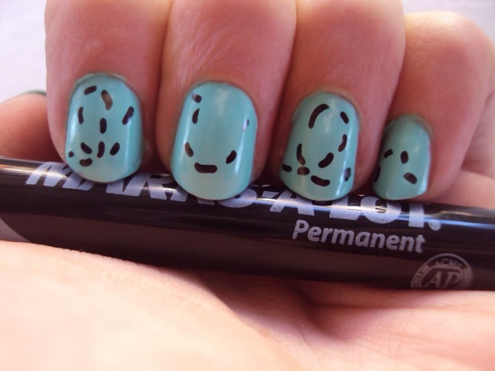 using a sharpie or a striper with black nail polish (sharpies are easier!) create dashes across your nail. this will be "the trail the bee left behind" do this on all nails except for your thumb