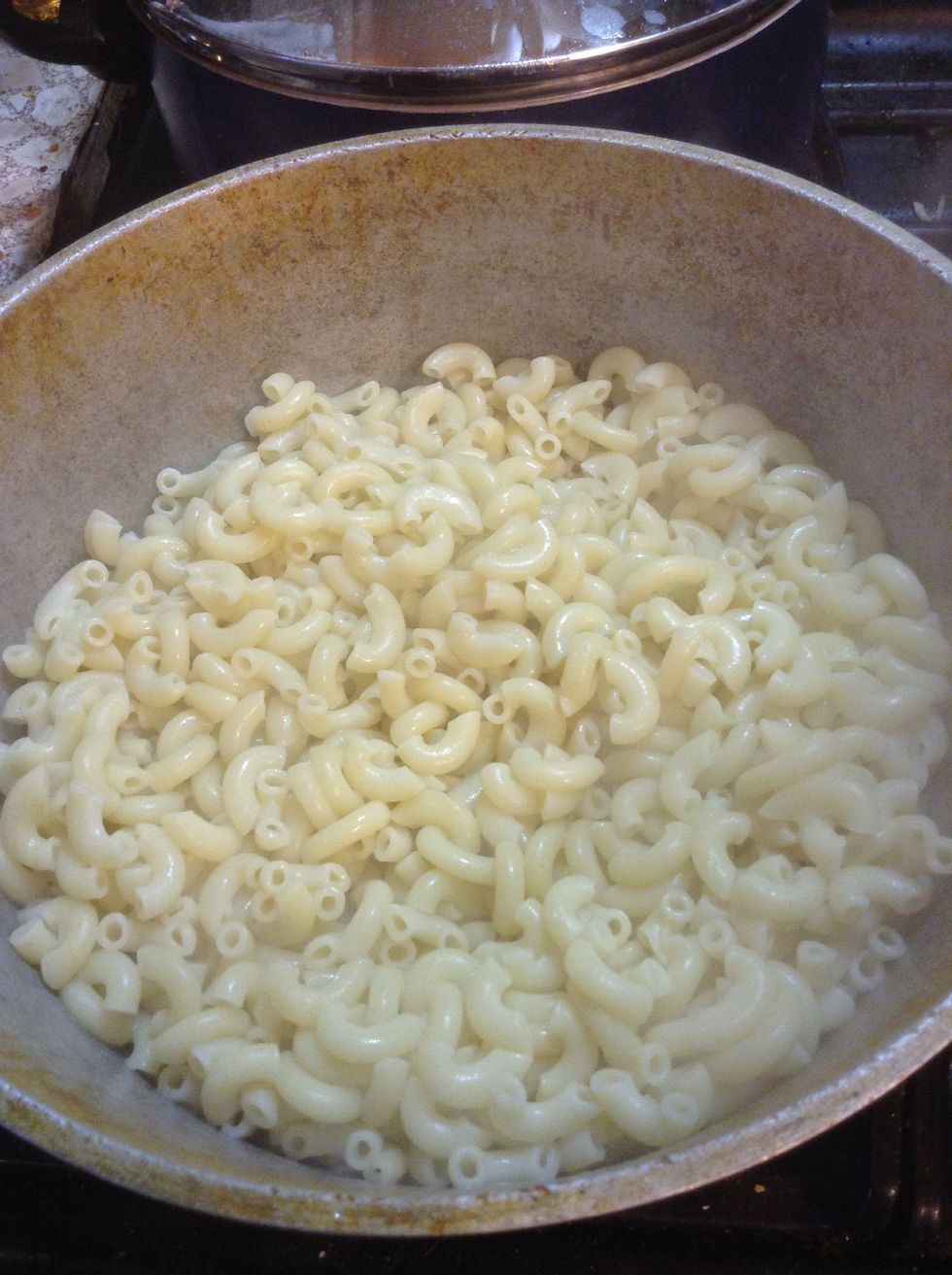 Using a slotted spoon, place your cooked noodles in your casserole. Now your pot of heaven is taking shape!
