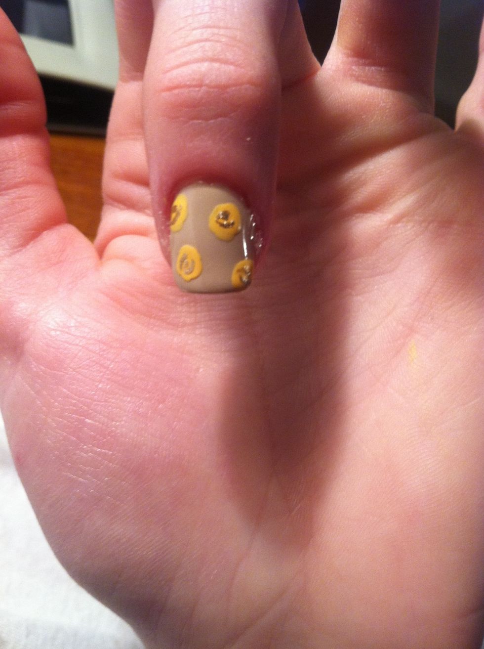 Using a small detail brush, add in some half circles and squiggles. (I'm using Sally Hansen Insta-Dri's Go For Gold)