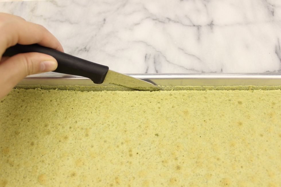 Using a small knife, cut along the edge of the pan to loosen the cake.