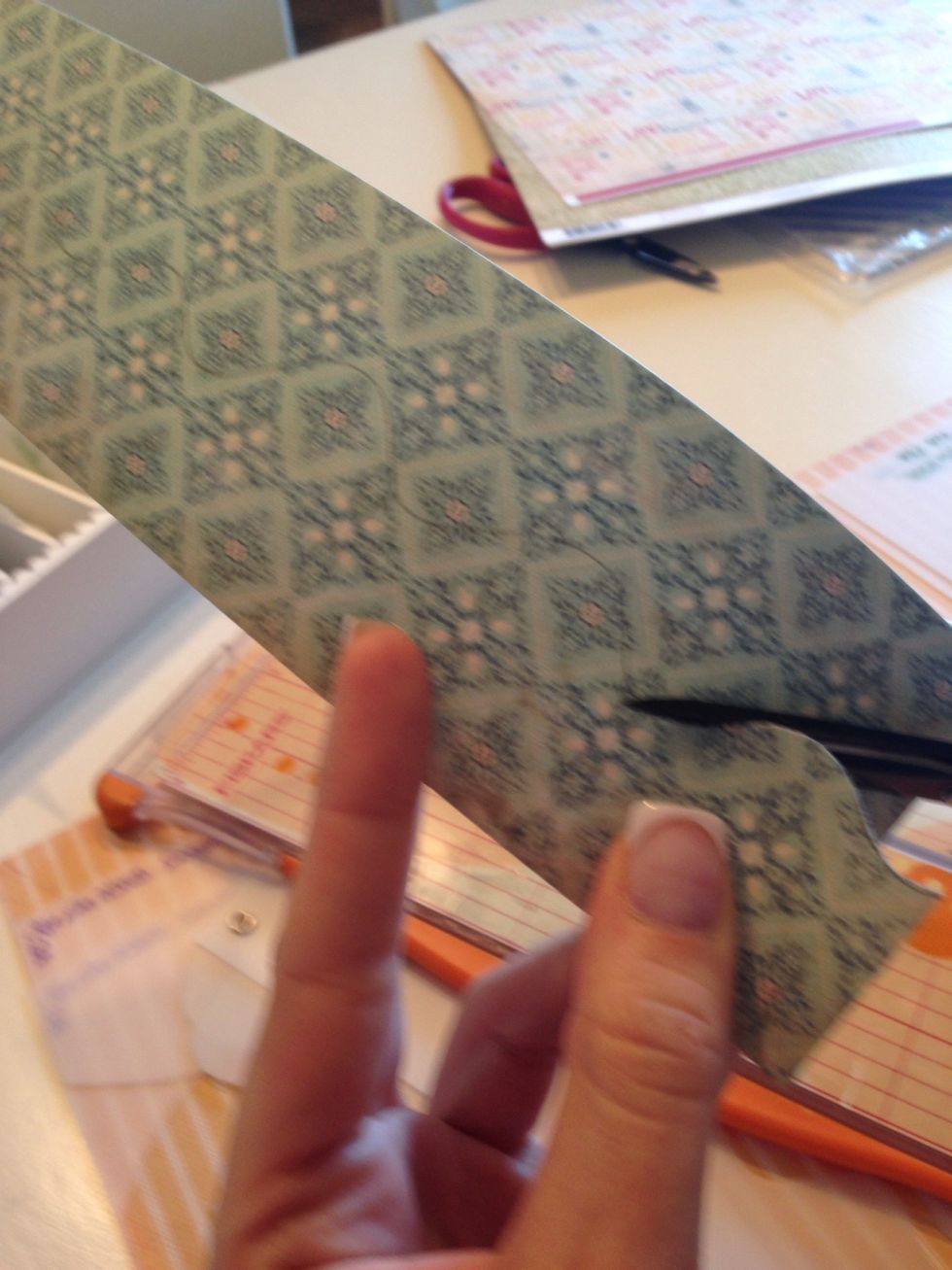 Using a small pair of sharp scissors, make one cut up the center following your line.