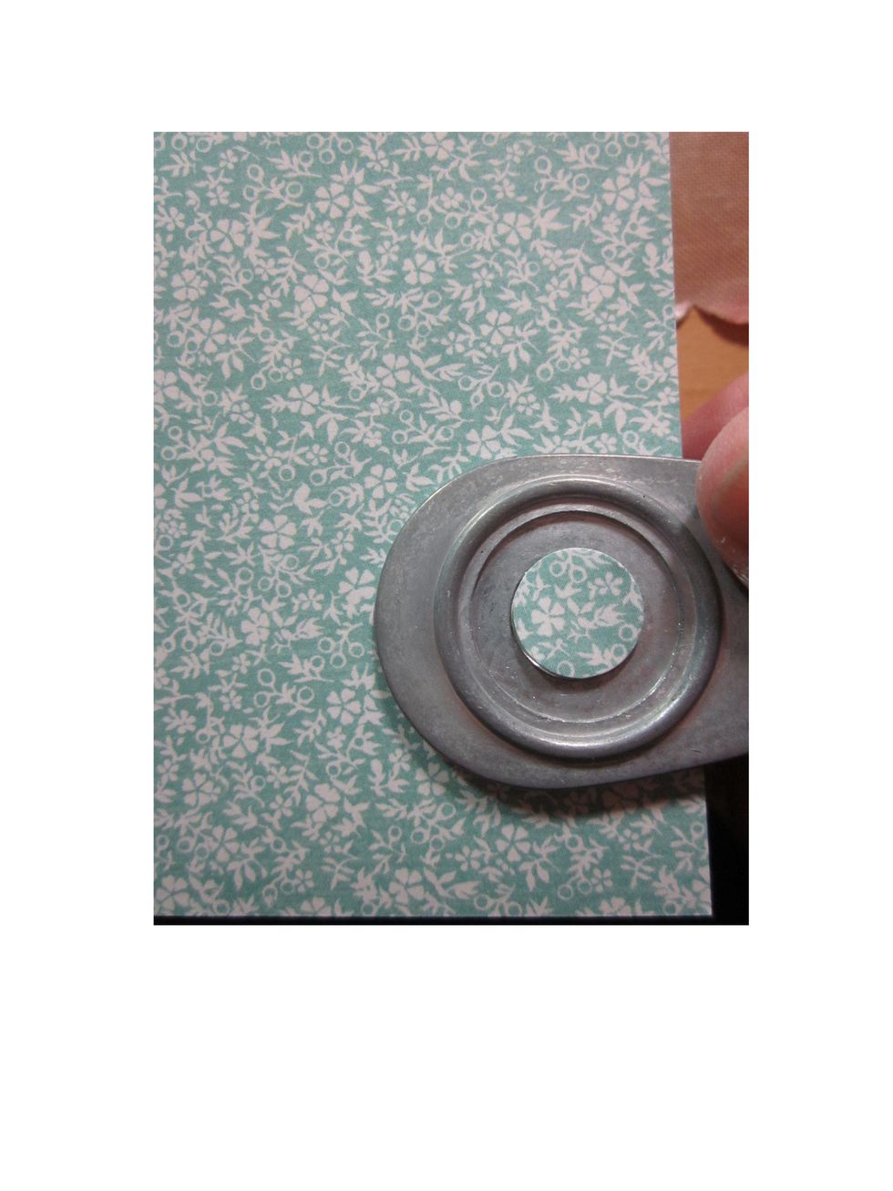 Using a small punch, cut out mini circles.  You'll need two.