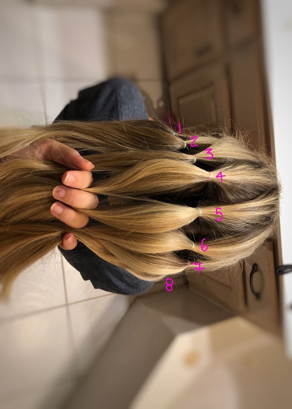 Using a small toothed comb, separate hair into 8 sections.