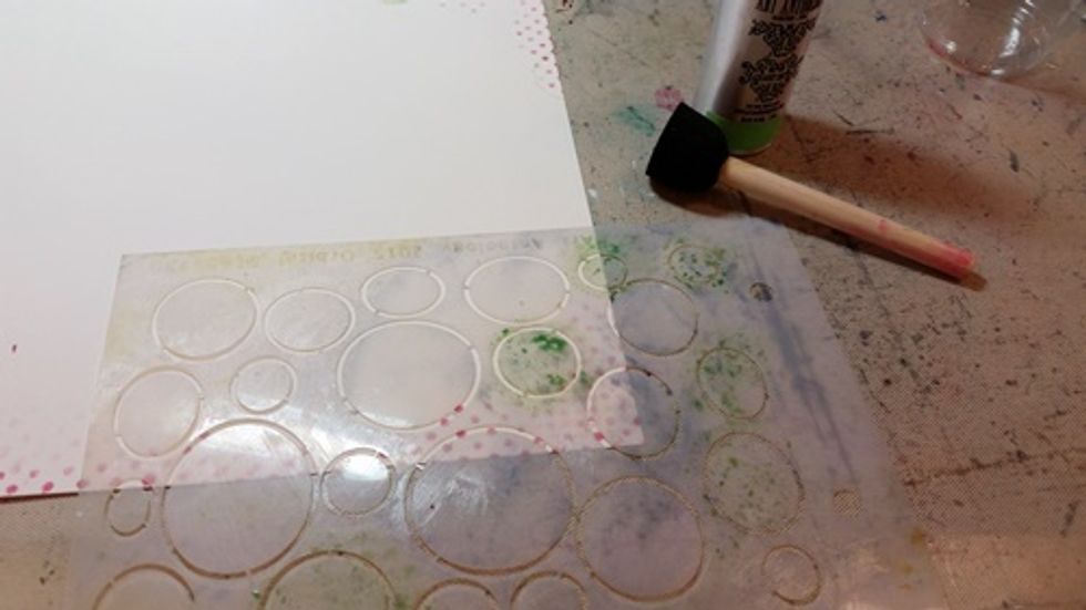 Using a sponge apply Granny Smith Colorations through a stencil.. This is a great way to have complete control of color placement,
