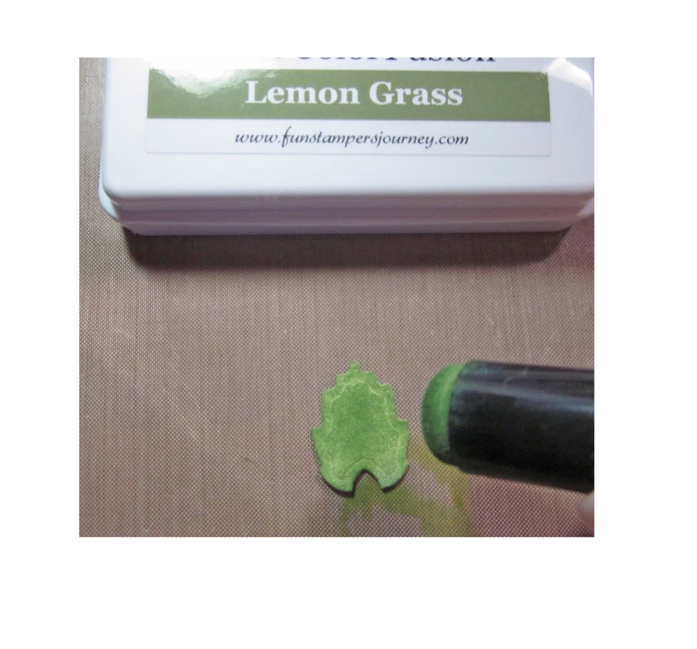 Using a sponge dauber cover the leaf with a base coat of a lighter green.