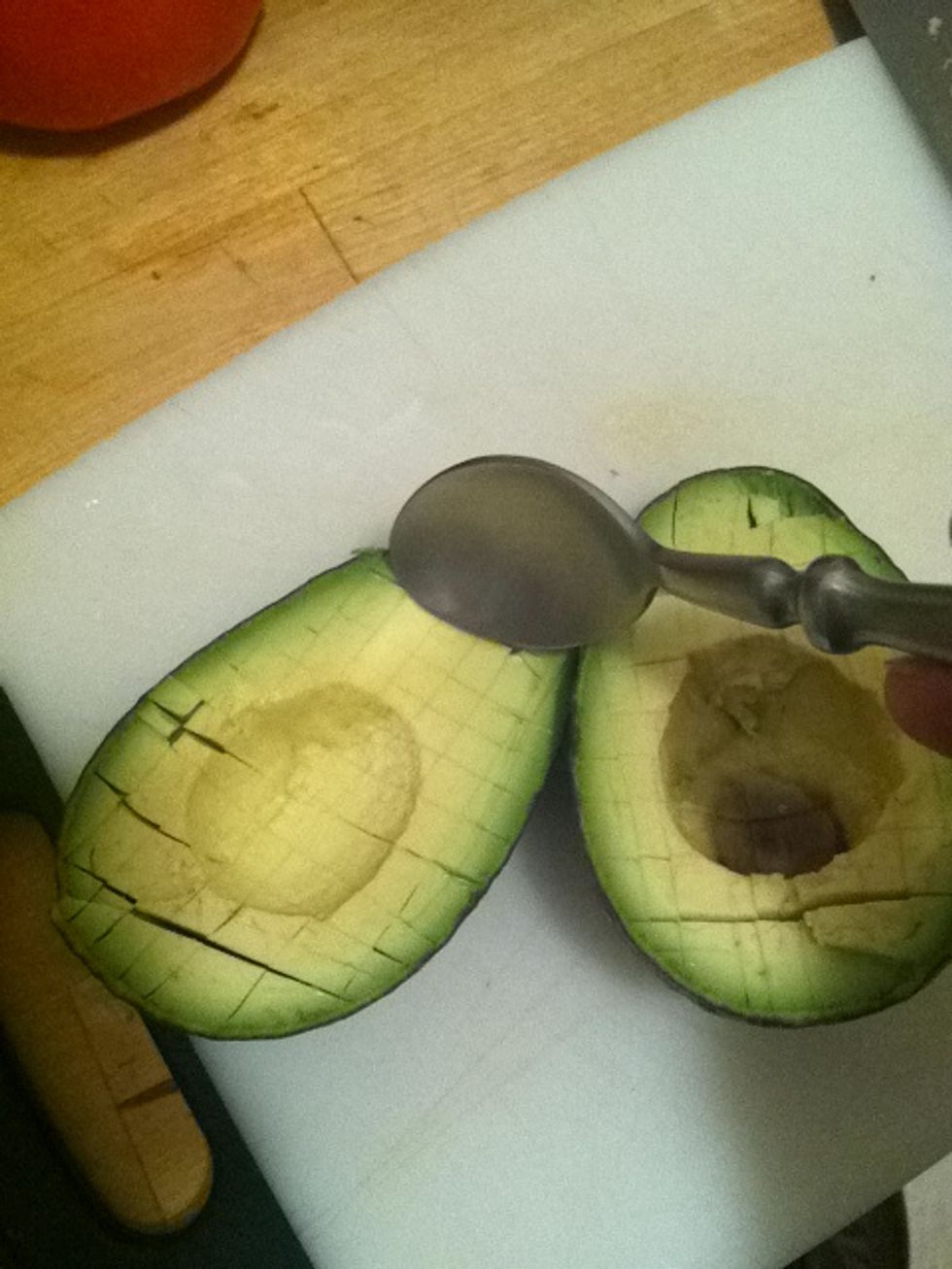 Using a spoon, dig out layers of avocado. The deeper or shallower you go the larger or smaller your pieces will be.